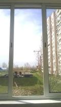 Раздвижные окна на балконе дома на Позняках в Киеве